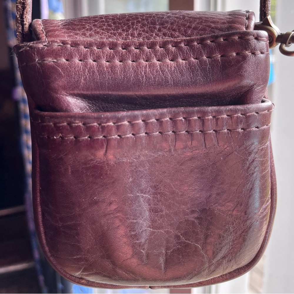 Small leather purse 5 x 4 1/2” brown with button closure, very good condition..